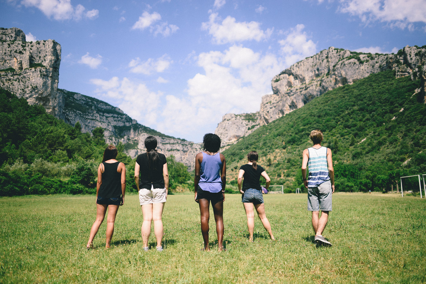 Five students observe a gap in a cliff