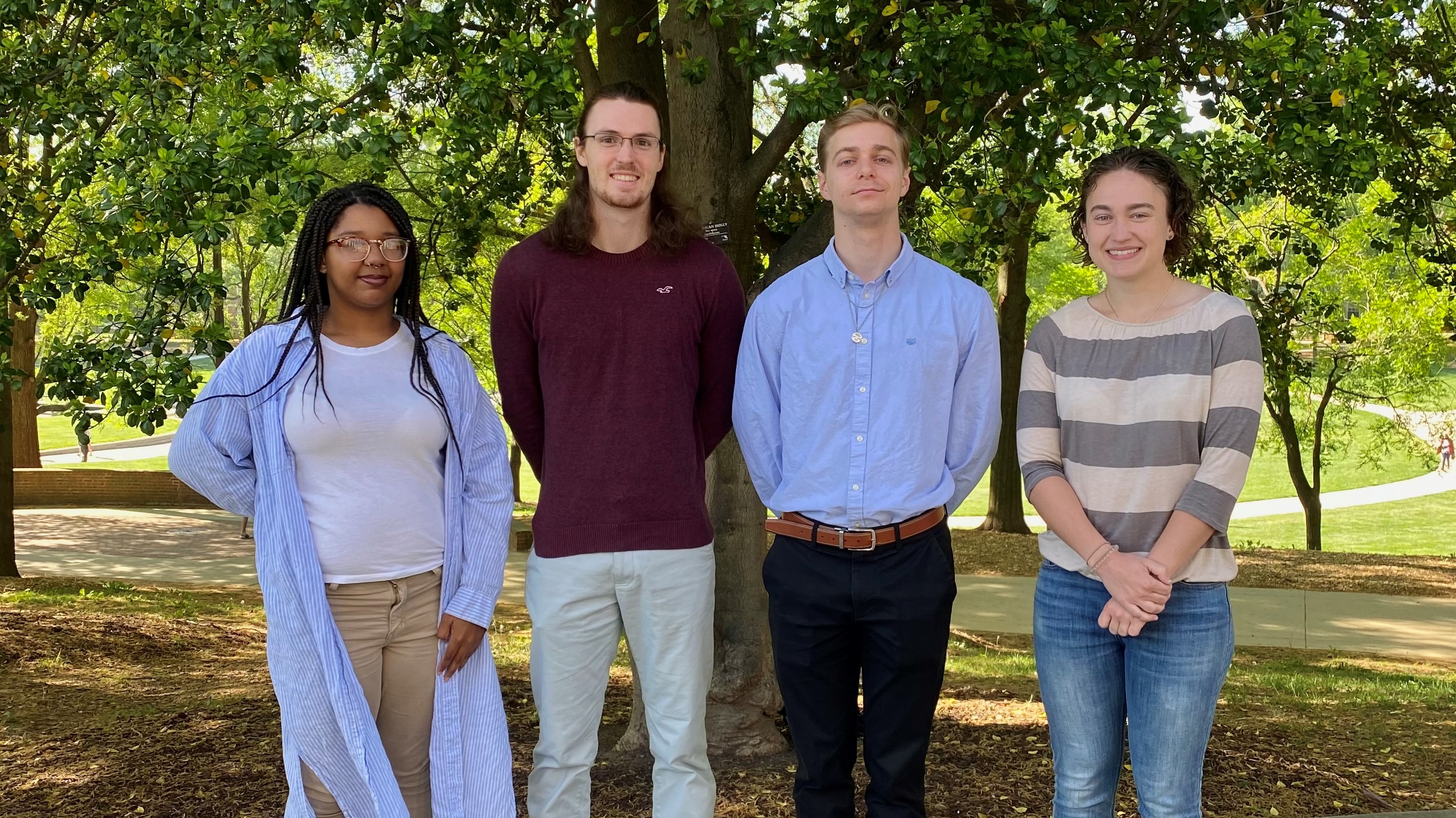 four boren scholars standing outside